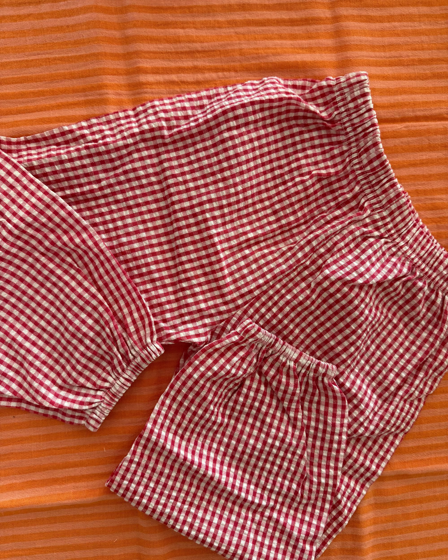 Geruite roze broek 86/92